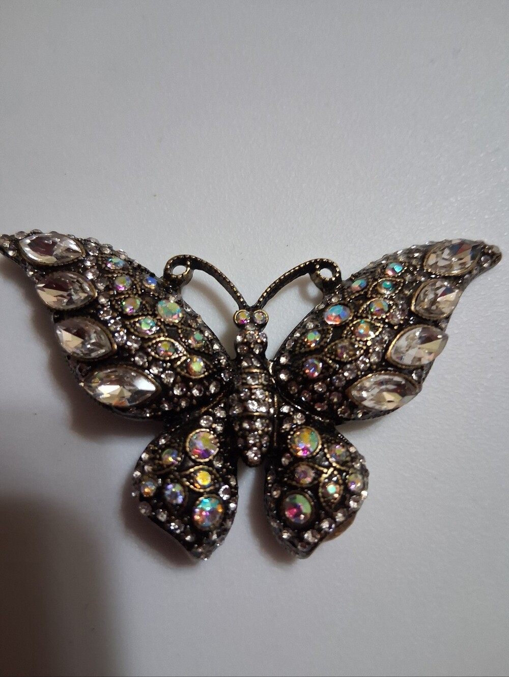 vintage-style rhinestone butterfly magnetic brooch.